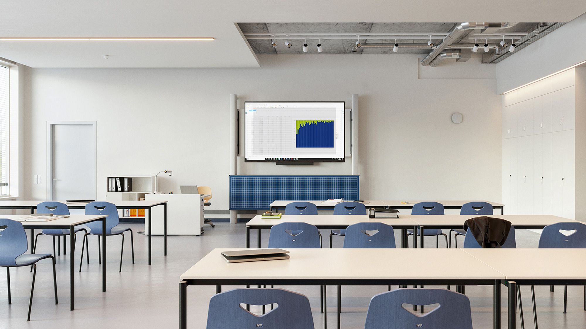 Seminar room with display and blue board in front of VS tables and JUMPER chairs