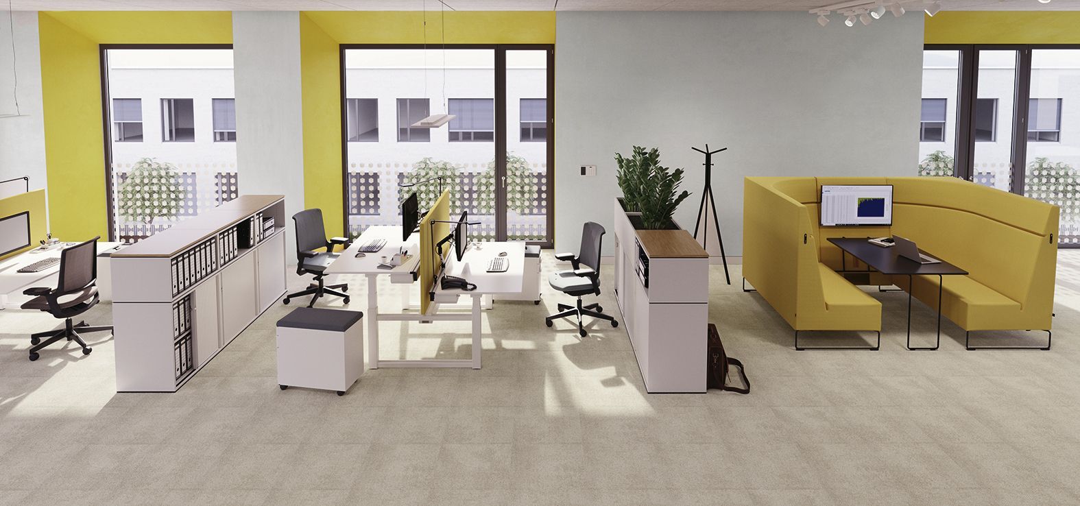 Open-plan office landscape with double workstations and meeting corner featuring HiBack armchairs from the Lounge series