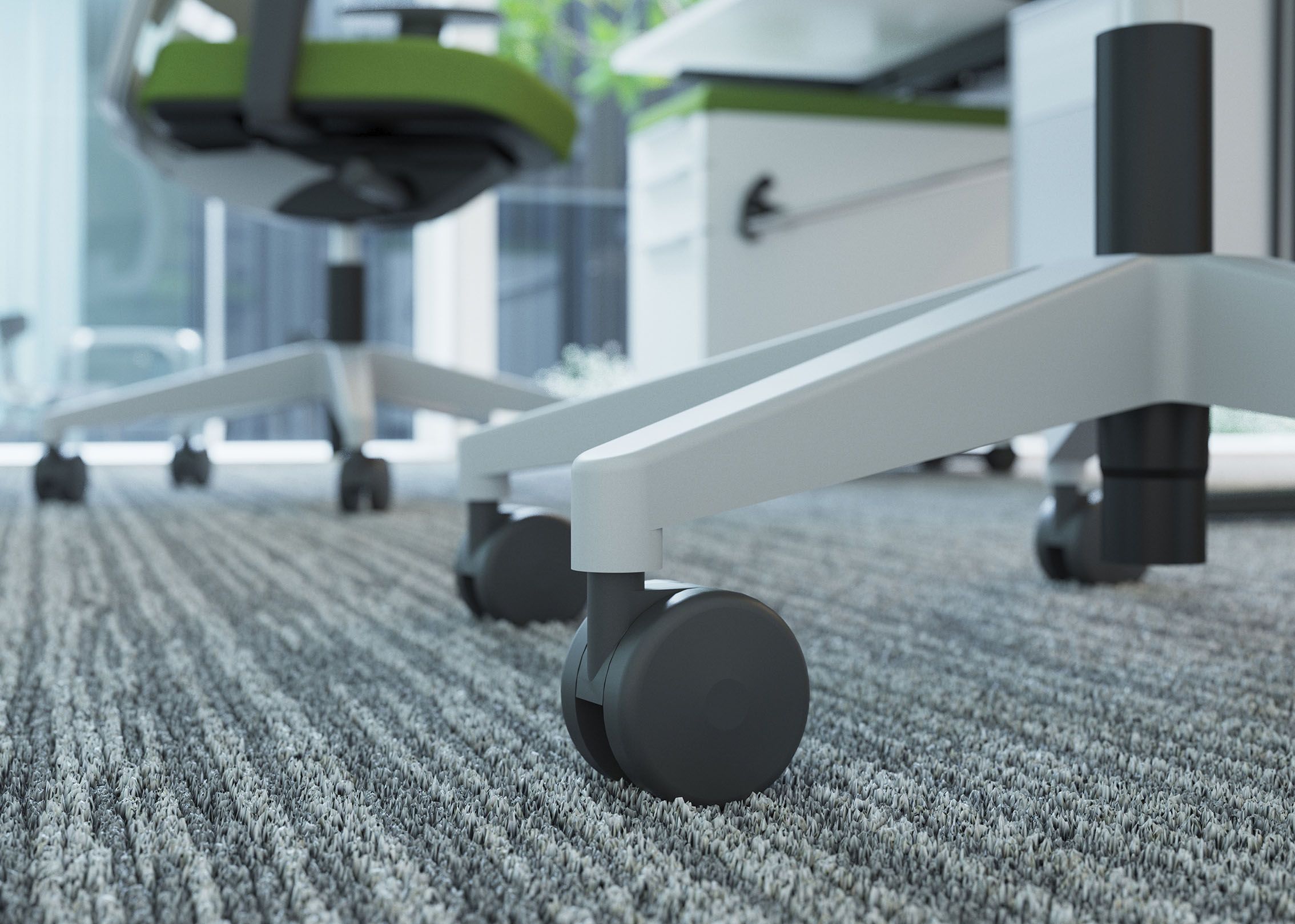 Close-up of a hard castor of a VS office chair on carpet