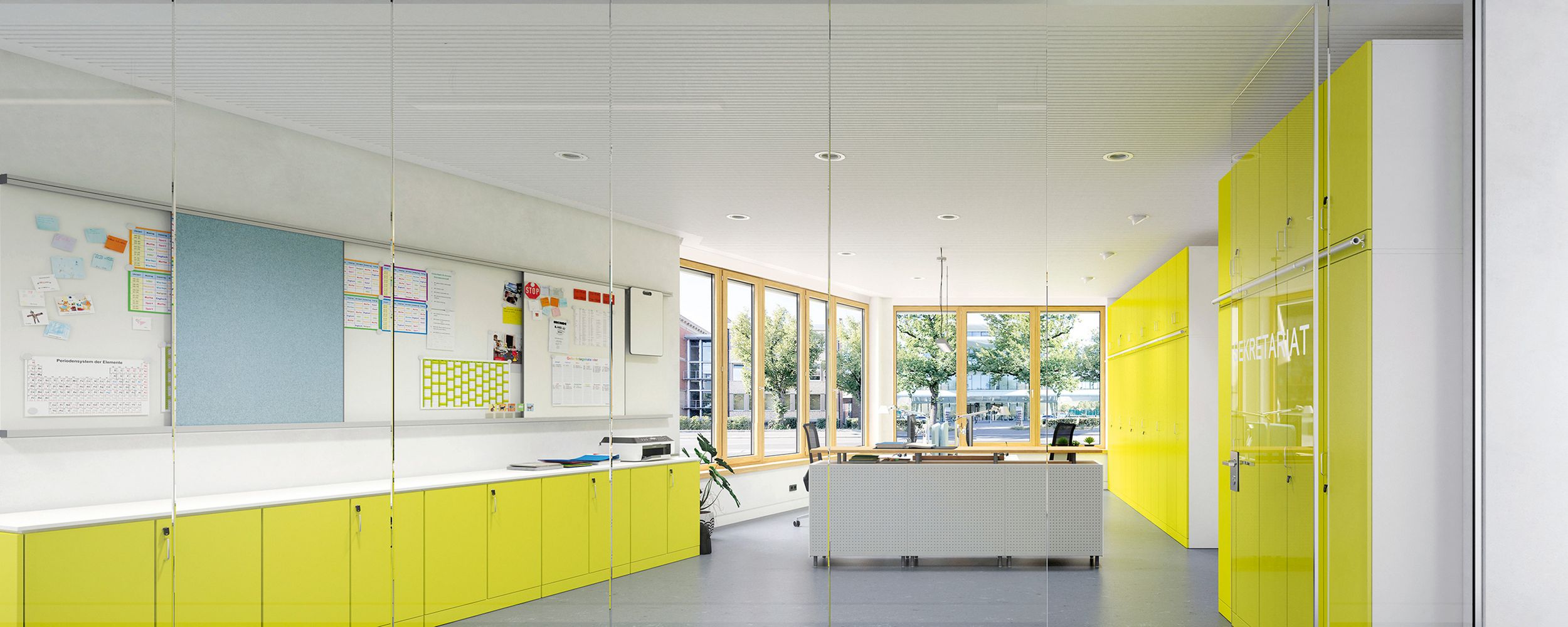 A school secretary's office furnished by VS with lockable cabinets and a counter as a room divider