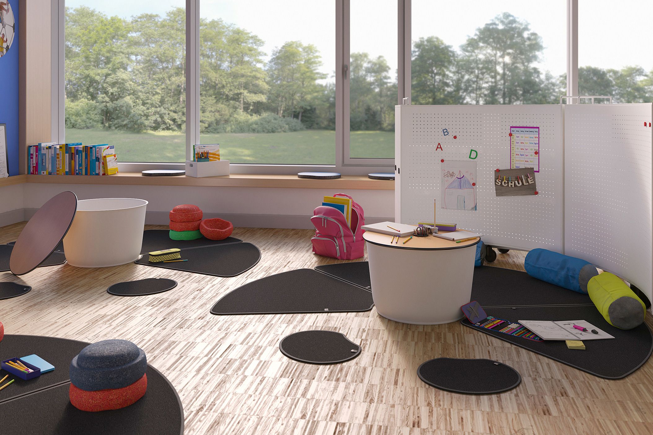 Spielbereich mit Sitzmatten, niedrigen Tischen und anderen bodennahen Möbeln der Serie FloorFriends von VS