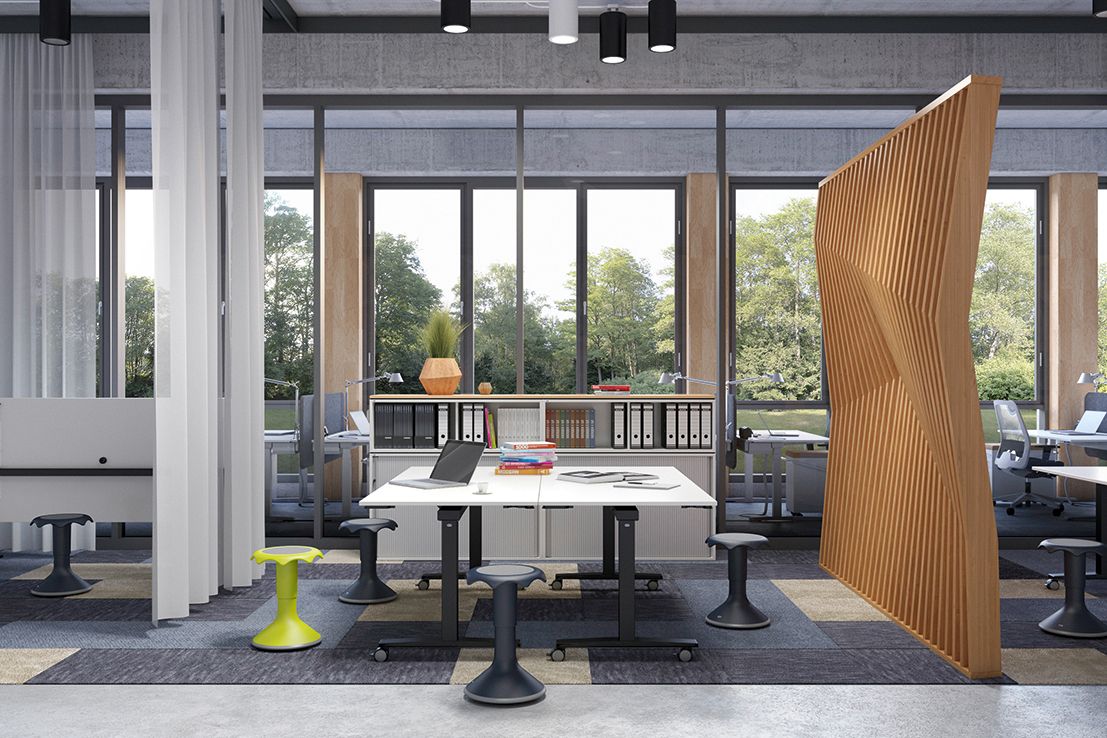 Two FlipTable desks with Hokki stools form a group work station in a modern office