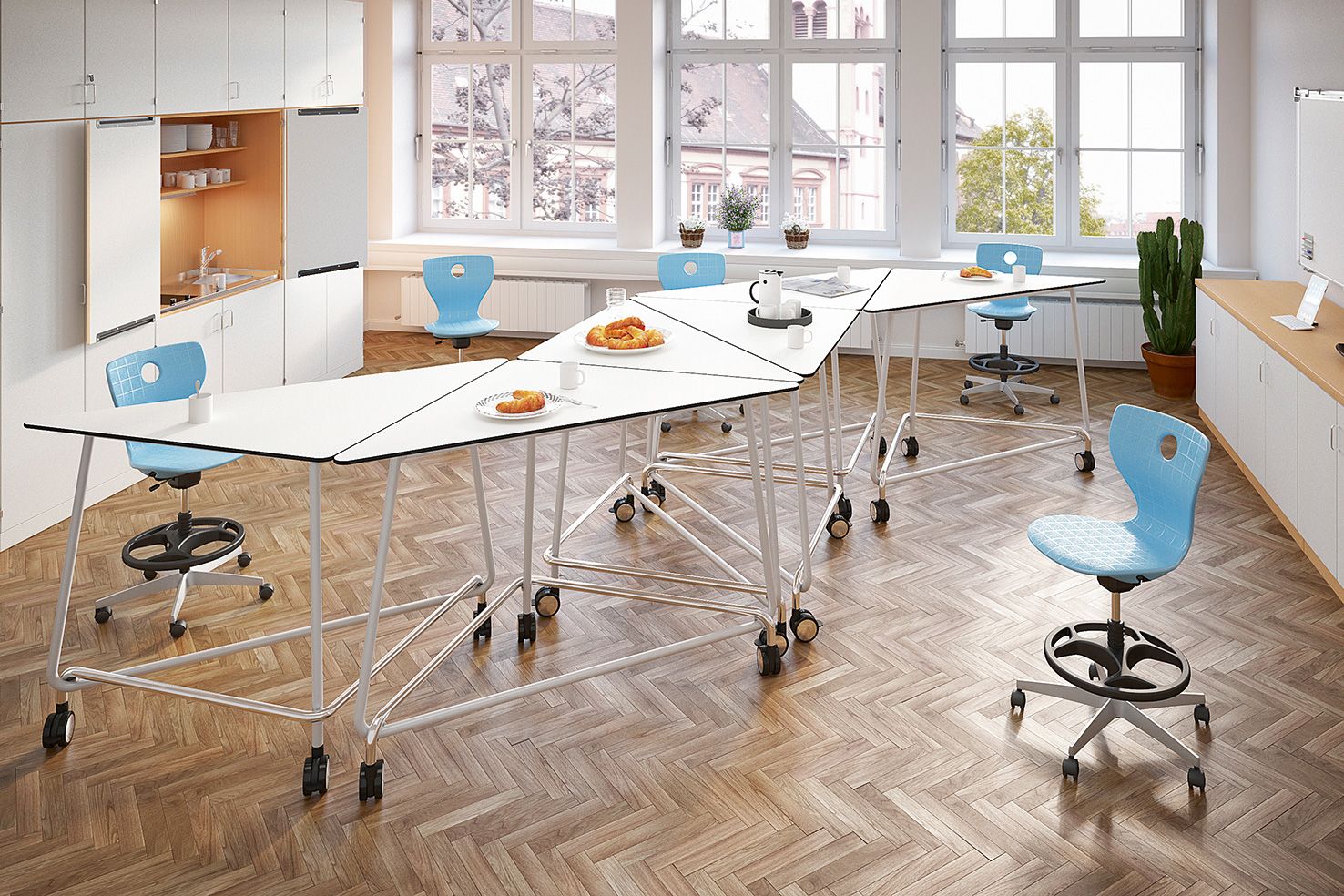 A tea kitchen with TriUnion standing tables and height-adjustable PantoMove chairs by VS