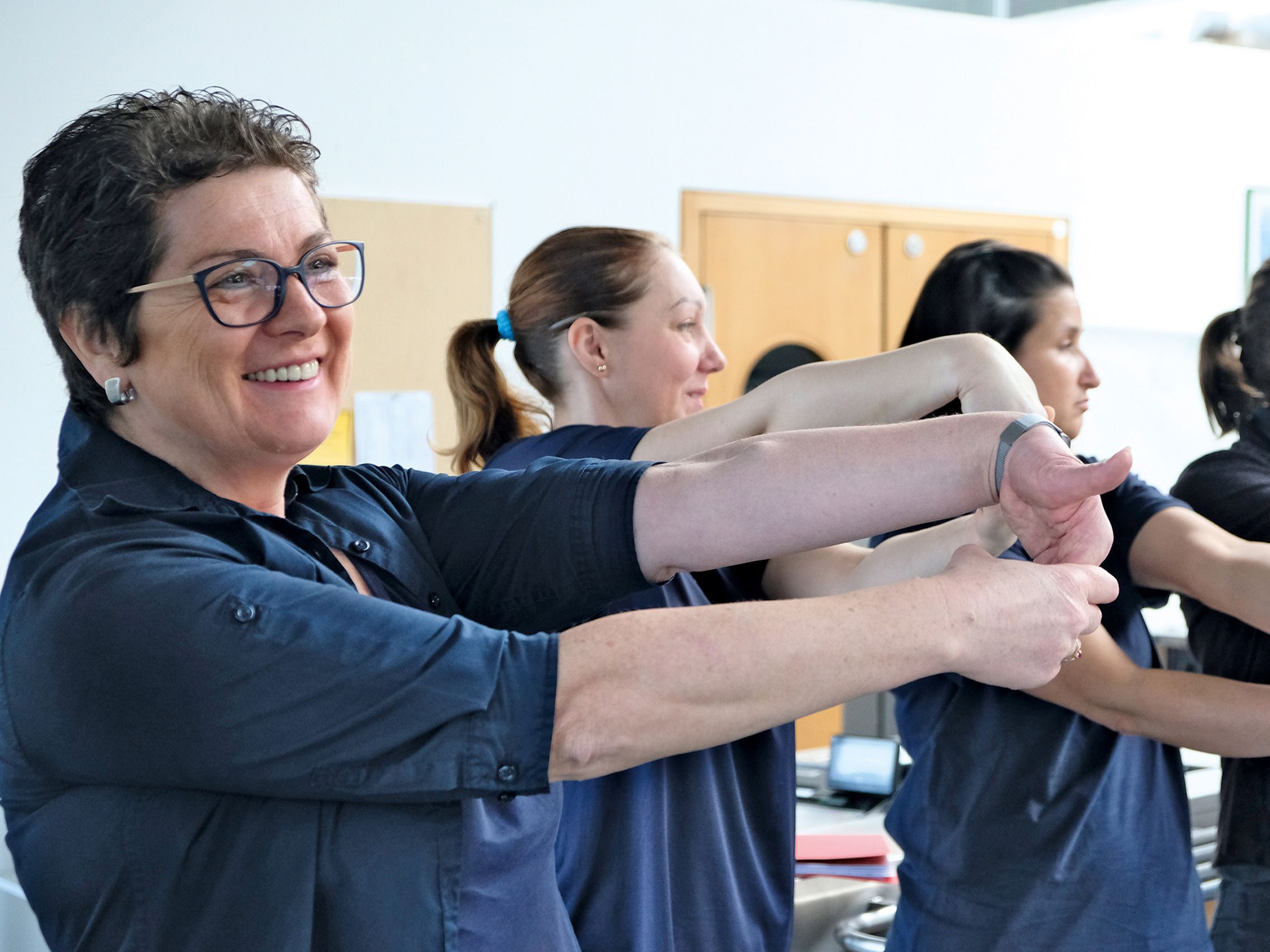 Employees do gymnastics during their work break