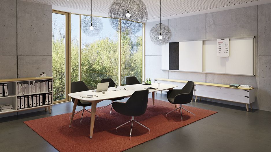 Meeting room with oval conference table from the JustBe series and Fan upholstered armchairs by VS