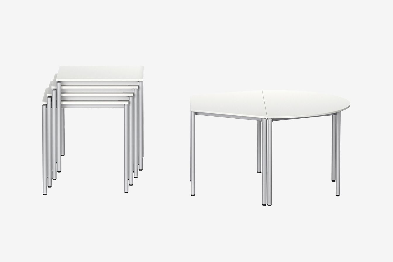 Stacked LiteTable students‘ tables on the left, one trapezoid and one semi-circular students’ table LiteTable by VS on the right