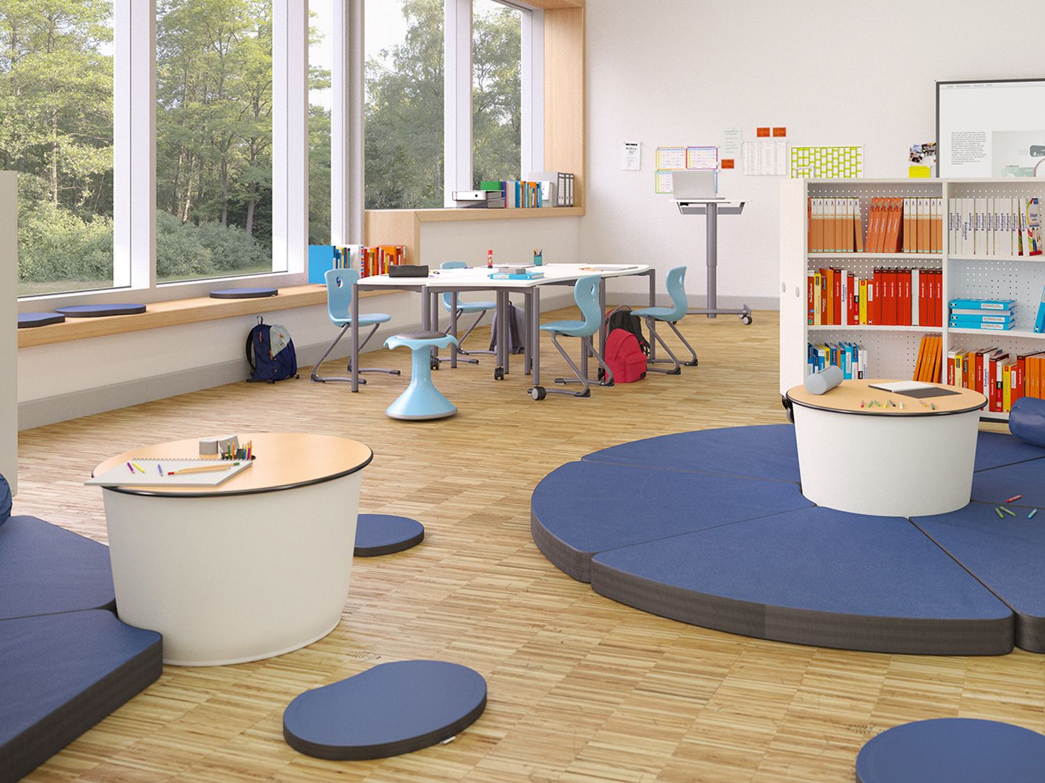 Shift+ Landscape furniture such as the padded floor mats and the low Gugl table from the FloorFriends series by VS in a classroom