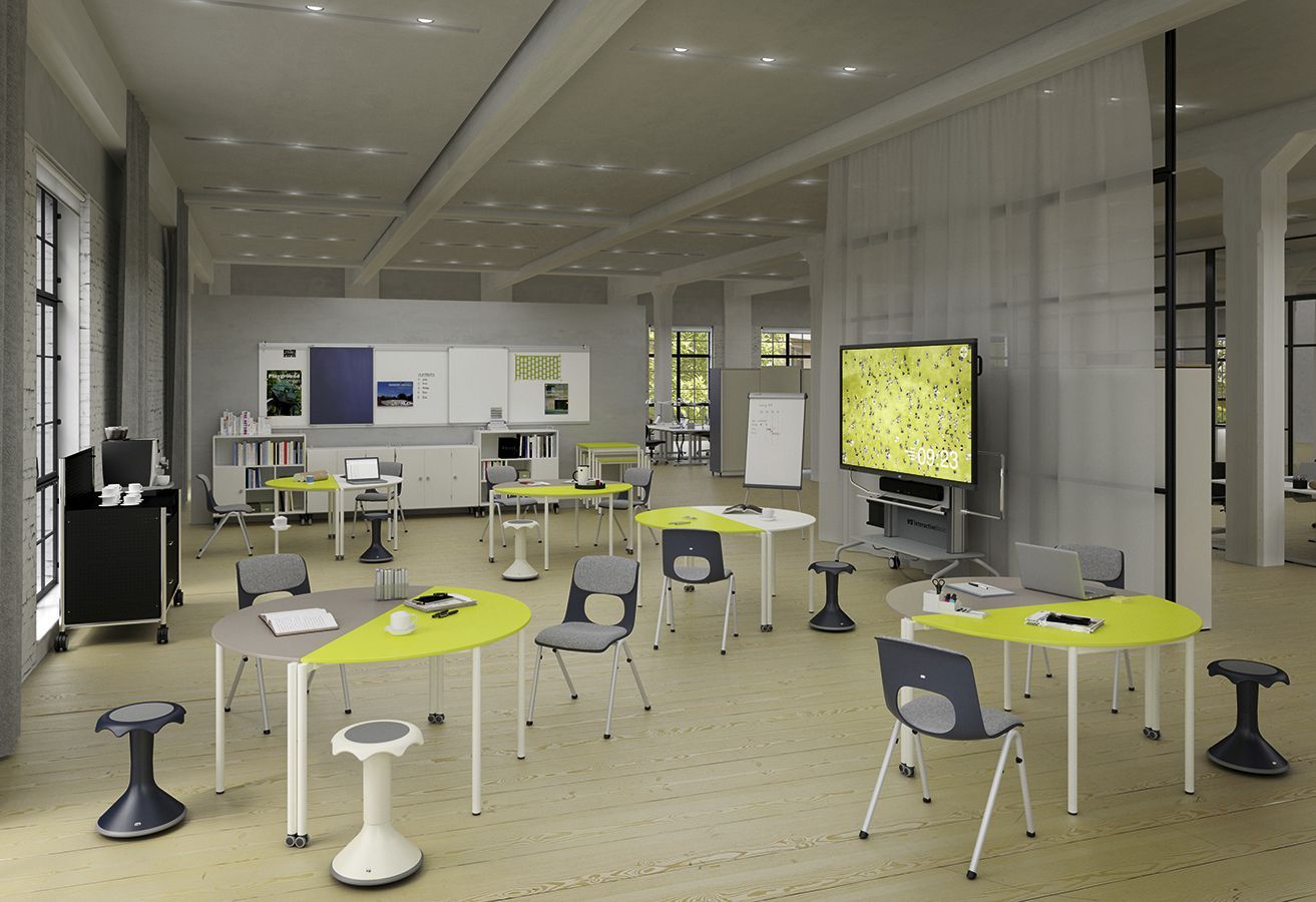 An office for teachers with mobile semi-circular tables, NF-Compass chairs and Hokkis